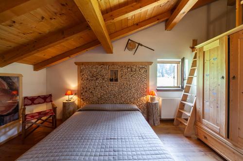 Postel nebo postele na pokoji v ubytování Albergo Lozen
