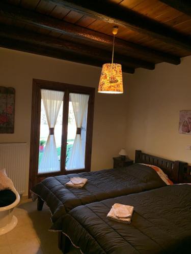 Кровать или кровати в номере Villa Argie