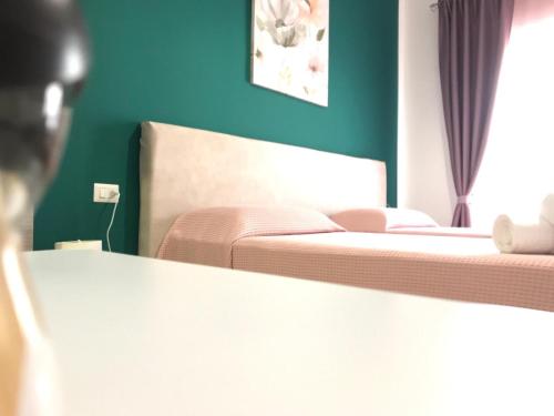Postel nebo postele na pokoji v ubytování B&B Le Stanze Al Centro