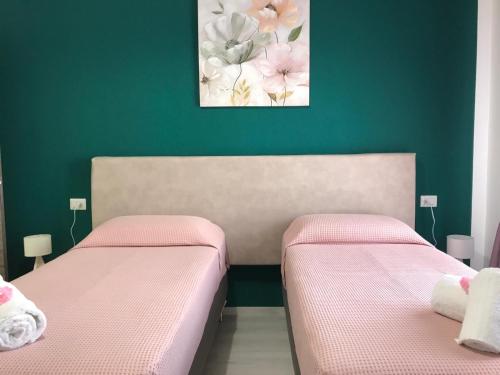 Postel nebo postele na pokoji v ubytování B&B Le Stanze Al Centro