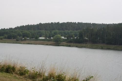a large body of water with trees in the background at Bungalow; Haus 111 Ferienpark Twistesee, Bad Arolsen in Bad Arolsen