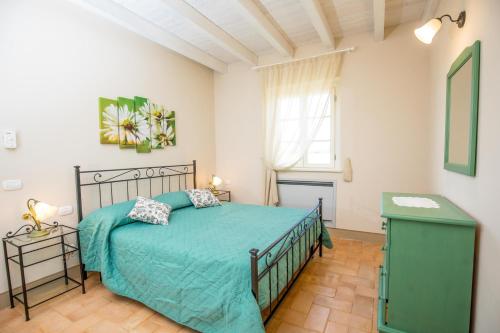 Postel nebo postele na pokoji v ubytování Agriturismo Colle Oliveto