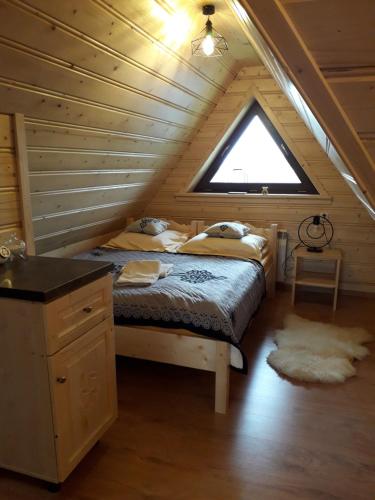 Postel nebo postele na pokoji v ubytování Apartamenty u Bacy