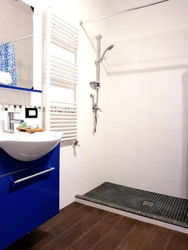 a bathroom with a sink and a shower at BB Hotel Pupi 93 in Palermo