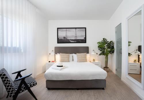 Ένα ή περισσότερα κρεβάτια σε δωμάτιο στο Sea Executive Suites