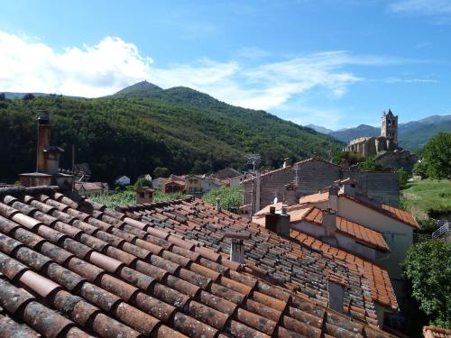 a view of a village with mountains in the background at Maison Baxter in Prats-de-Mollo-la-Preste