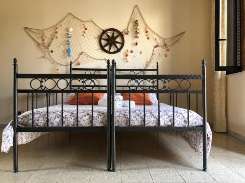 a bed that has a picture of a horse on it at Appartamento Porto Marina in Licata