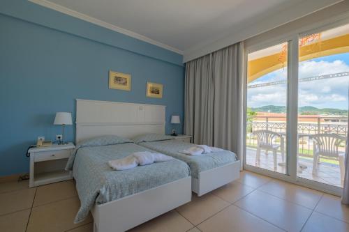 Katil atau katil-katil dalam bilik di Hotel Athina