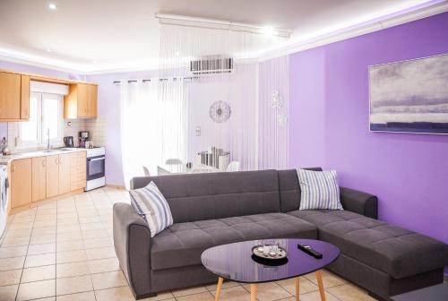 a living room with a couch and a table at Nina Apartment in Chania Town