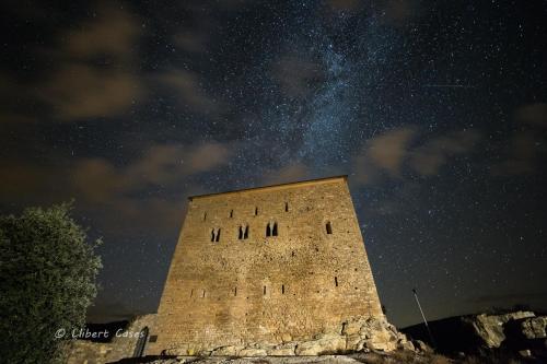 a brick building with a starry sky behind it at Lo passeig in Tremp