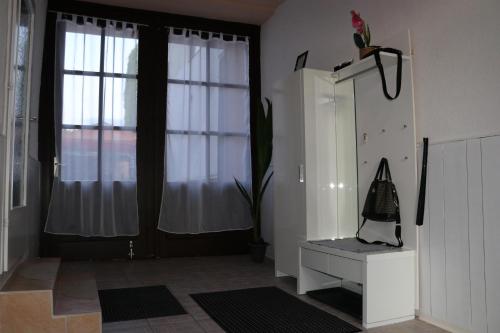 a room with a window with a plant and a shelf at The Lakehouse Villa Neusiedl am See Wienerstraße 8 in Neusiedl am See