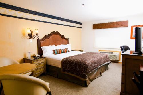 Postel nebo postele na pokoji v ubytování Business Hotel & Suites María Bonita