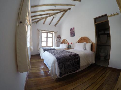 Ένα ή περισσότερα κρεβάτια σε δωμάτιο στο Parwa Guest House