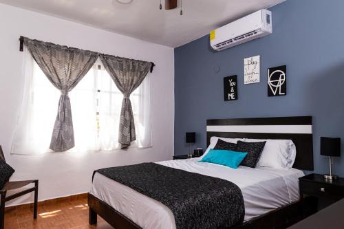 Postel nebo postele na pokoji v ubytování Santa Fe Studios And Suites
