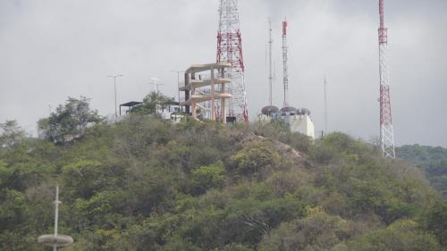 a building on top of a hill with two cranes at Casa del Parque Vallarta in Puerto Vallarta