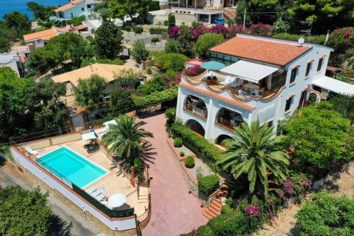 an aerial view of a house with a swimming pool at Villa del Golfo Urio with swimming pool shared by the two apartments in Santa Flavia