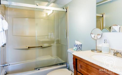 a bathroom with a shower and a sink at Bouchard Restaurant & Inn in Newport
