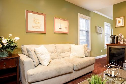 a living room with a couch and a fireplace at Bouchard Restaurant & Inn in Newport