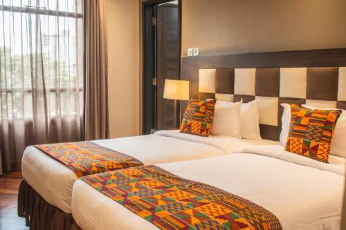 Postel nebo postele na pokoji v ubytování Longonot Place Serviced Apartment-Nairobi, City Centre CBD