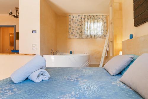 Una cama o camas en una habitación de Torre Sabea