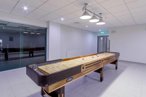 a ping pong table in an empty room at Medical SPA "Eglės sanatorija" Comfort Druskininkai in Druskininkai
