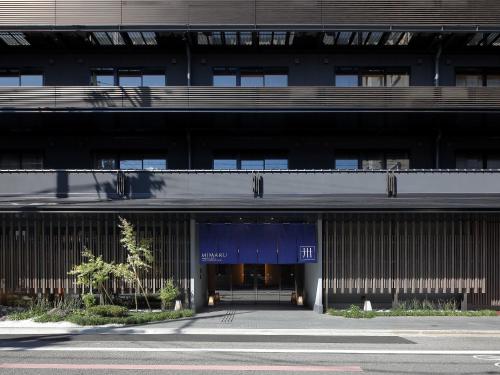 an external view of a building with a blue entrance at MIMARU Kyoto Shinmachi Sanjo in Kyoto