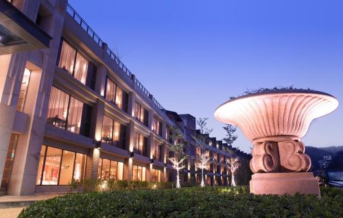 a large mushroom statue in front of a building at Lakeshore Hotel Hsinchu in Hsinchu City