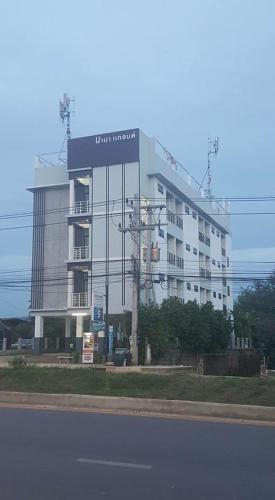 a large building on the side of a street at nana grand in Phrae