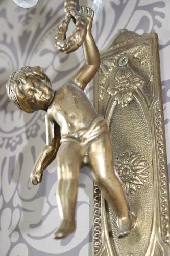 a gold statue of a man dancing on a plate at Causeway Hotel in Bushmills