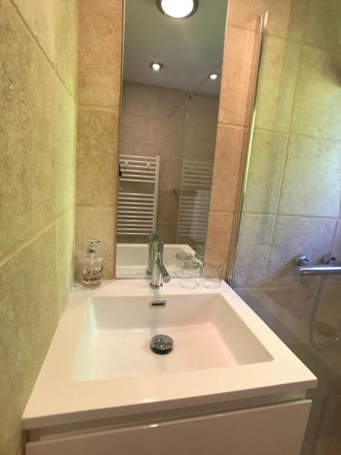 a bathroom with a sink and a mirror at Mer et Provence in La Cadière-dʼAzur