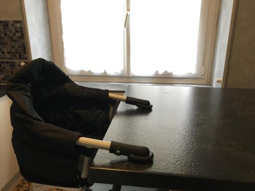 an umbrella sitting on top of a table at Au chat qui danse, T2 tout confort Intra-Muros in Saint Malo