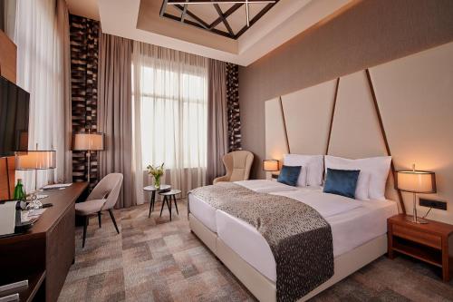 Postel nebo postele na pokoji v ubytování Artis Boutique Hotel