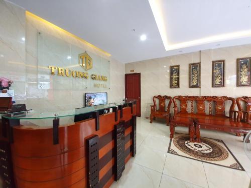 a hotel lobby with a bar and some chairs at Truong Giang Hotel in Ho Chi Minh City