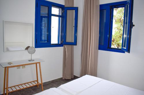 Ένα ή περισσότερα κρεβάτια σε δωμάτιο στο Muses seaside Villas