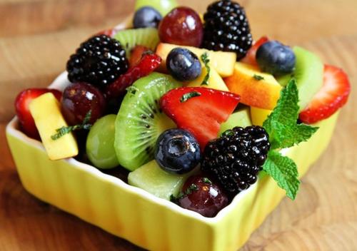 a fruit salad in a bowl on a table at B & B AMICI DELL'ETNA in Nicolosi