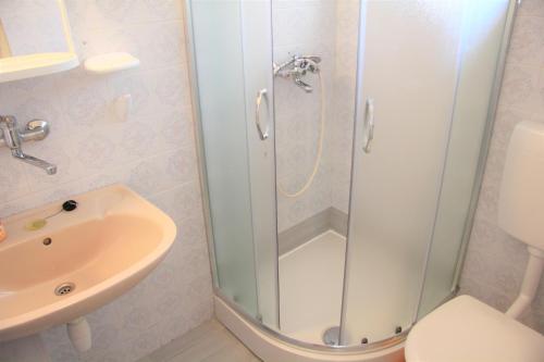 a bathroom with a shower and a sink at Apartments Delic in Stari Grad