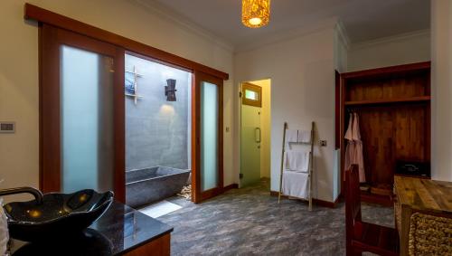 a bathroom with a sink and a bath tub at La Rivière d' Angkor Resort in Siem Reap