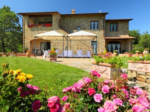 a house with flowers in front of it at Villa Zen by Interhome in Santa Cristina