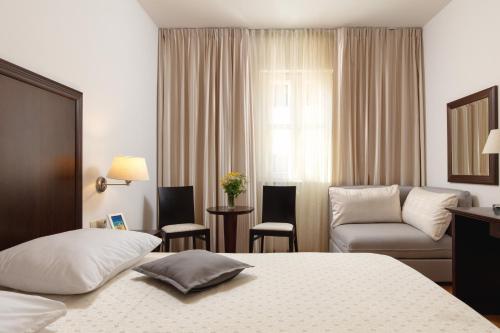 Postel nebo postele na pokoji v ubytování Hotel Croatia