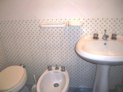 a bathroom with a sink and a toilet at L'Isolana Case Vacanza Palma 1 in Ponza