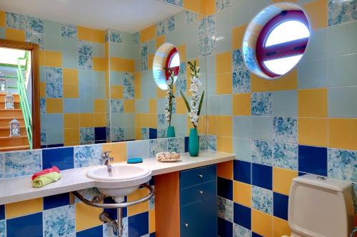 a bathroom with a sink and a mirror at Vila Marina -BBQ, pool & garden- by Seareen in Albufeira