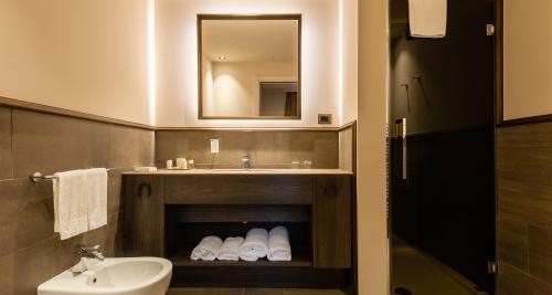 a bathroom with a sink and a mirror at Casa Munfrà in Cioccaro