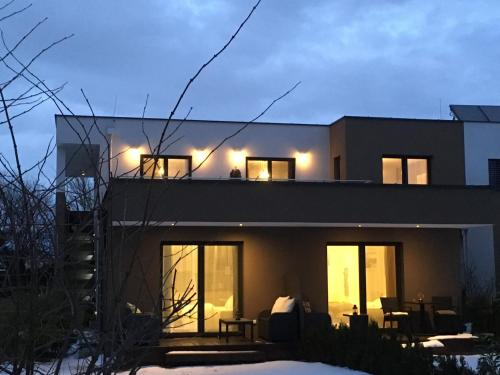 a house with lights on the top of it at Kal's Studio Apartment Salzburg in Salzburg