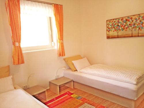 Postel nebo postele na pokoji v ubytování Suiten am Simmhof