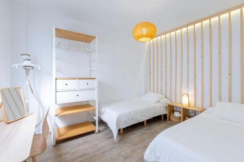 Ένα ή περισσότερα κρεβάτια σε δωμάτιο στο Attic Deluxe - 5beds + A/C + WiFi
