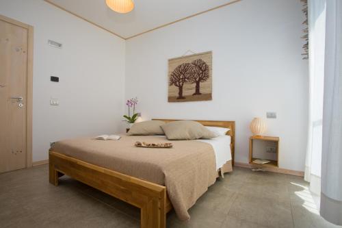 Ένα ή περισσότερα κρεβάτια σε δωμάτιο στο Bio B&B Vivere la Vita