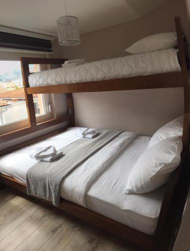 Postel nebo postele na pokoji v ubytování OzApartments