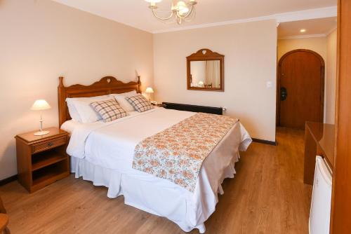 Hotel das Hortênsiasにあるベッド