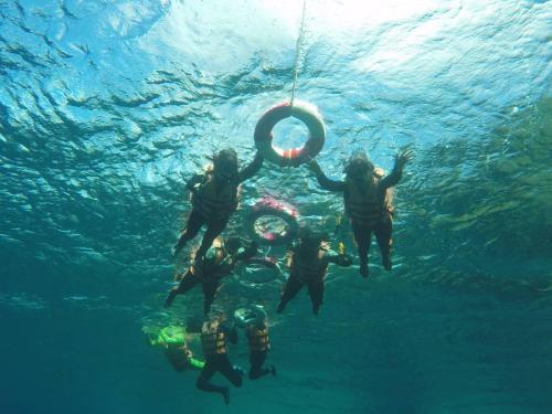 a group of people in the water with a life buoy at Haven Seaview Homestay in Lanyu