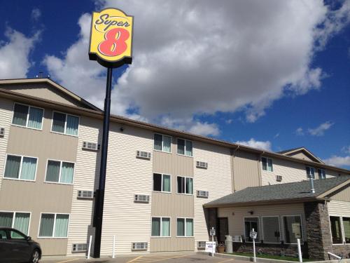 a sign for a fast food restaurant in front of a building at Super 8 by Wyndham Pocatello in Pocatello